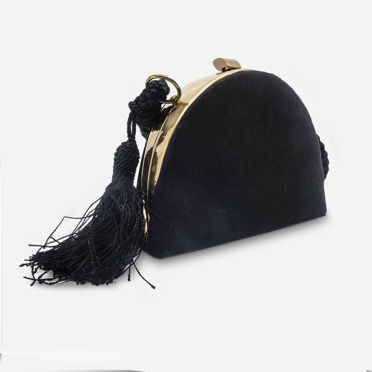 rose gold and black handbag