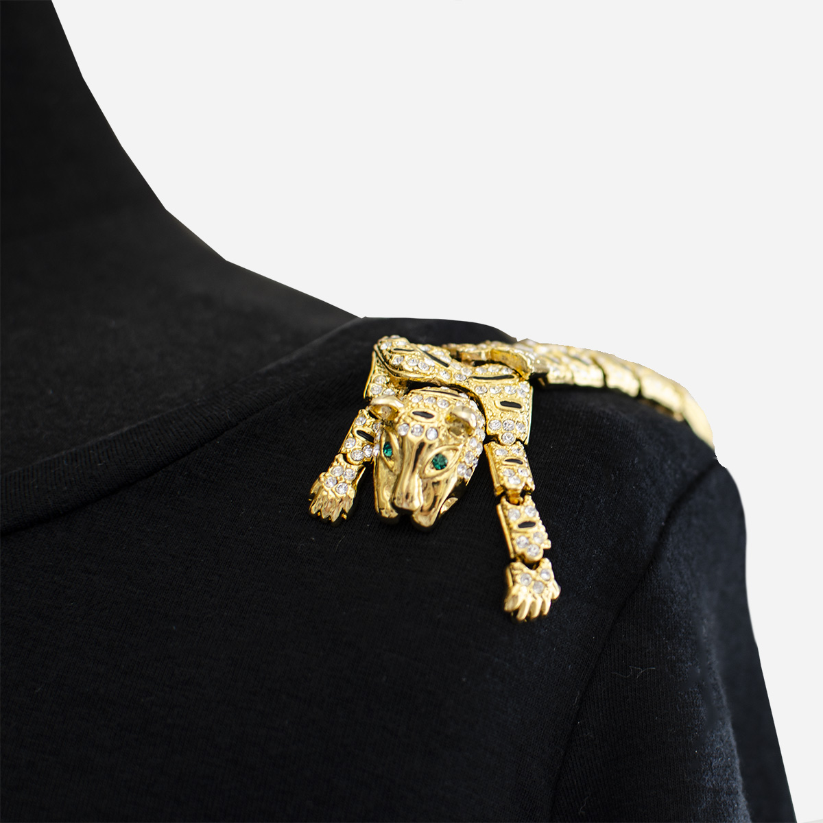 gold shoulder brooch