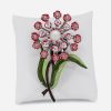 large pink flower brooch with green enamel stem