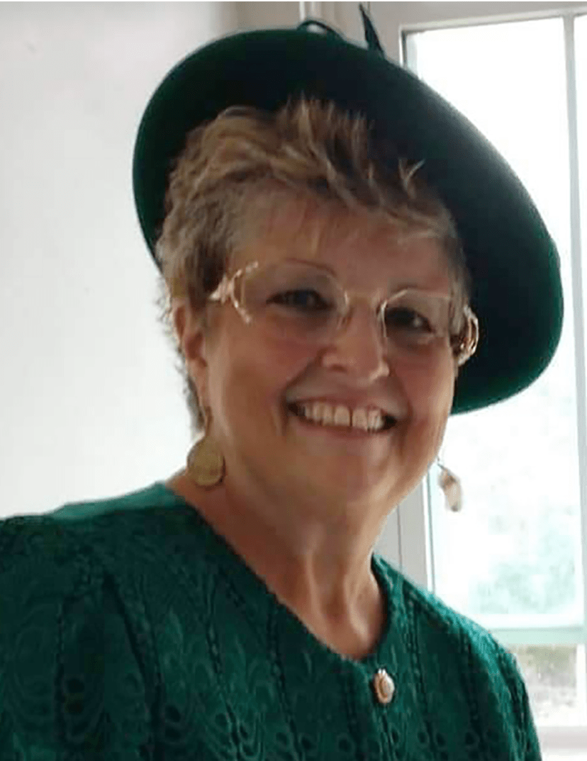 We matched a hat to her beautiful green suit