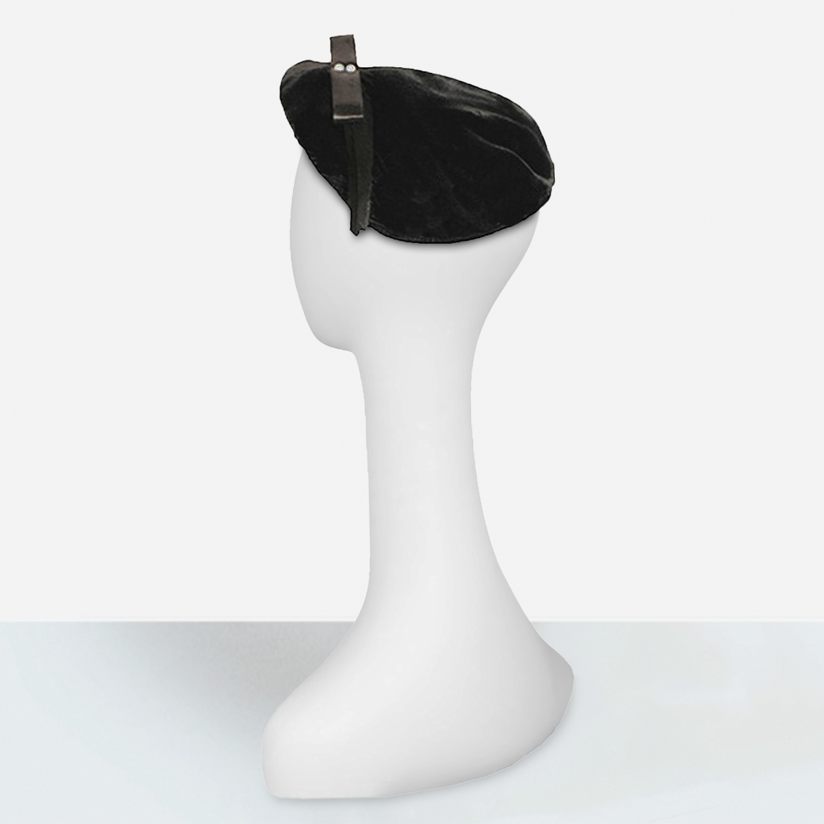 Black velvet beret with quill feather