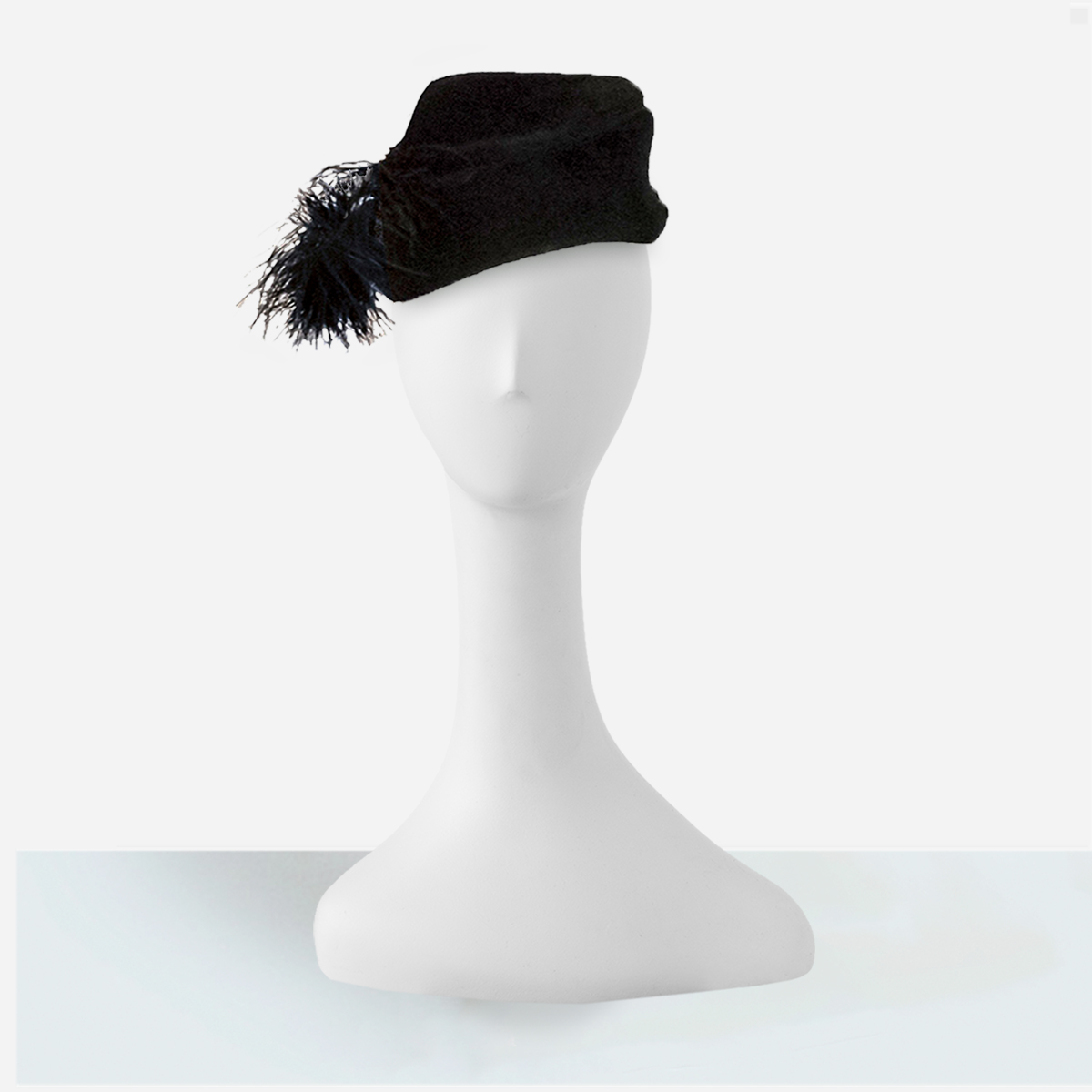 black vintage hat with feather pom