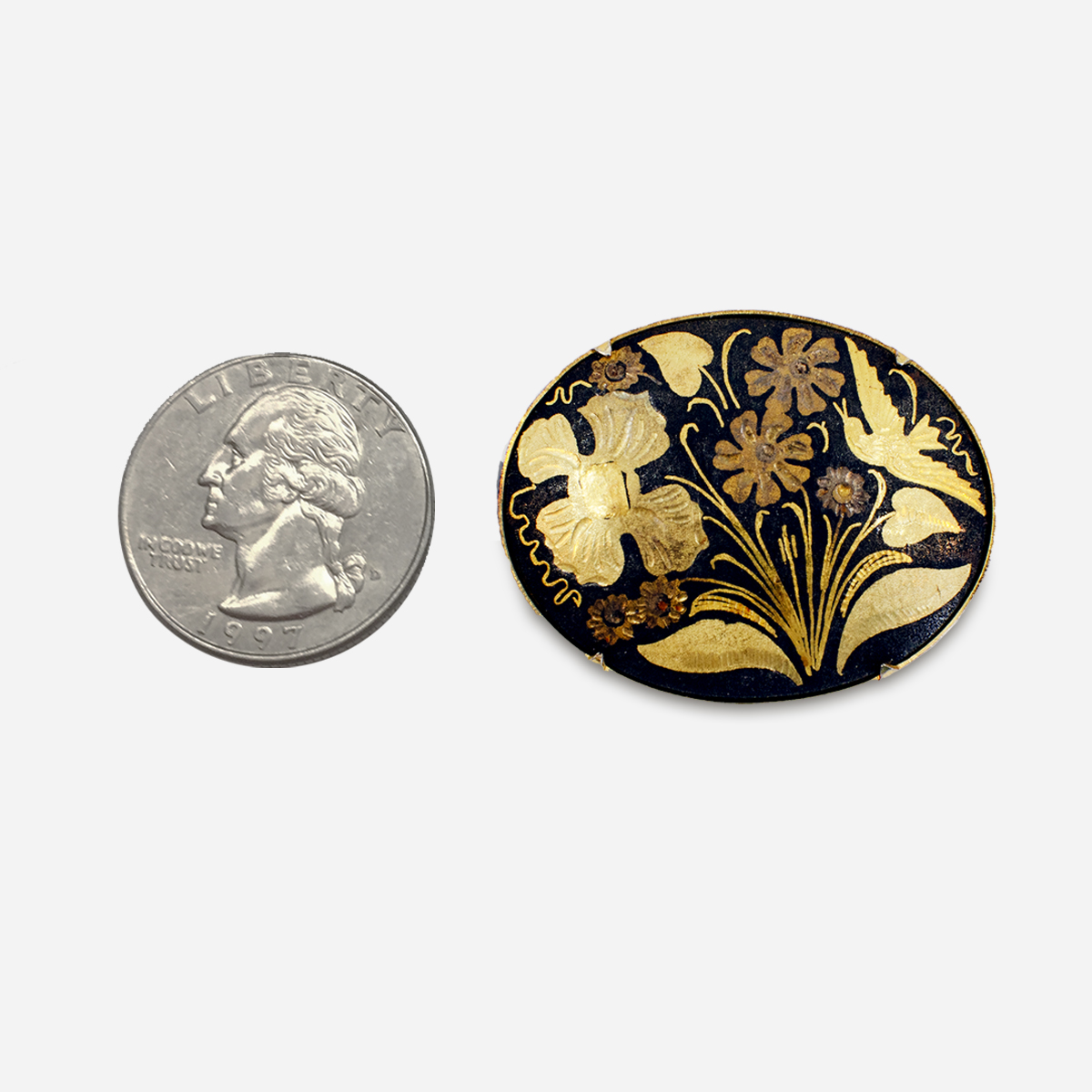 gold and black damascene pin
