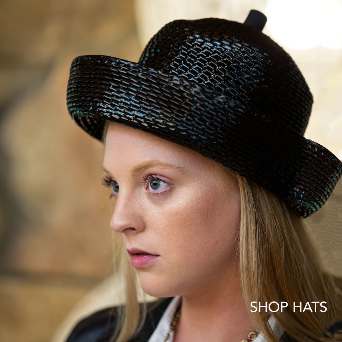 Shop vintage hats for women. Model wearing black straw breton with upturned brim by leslie james