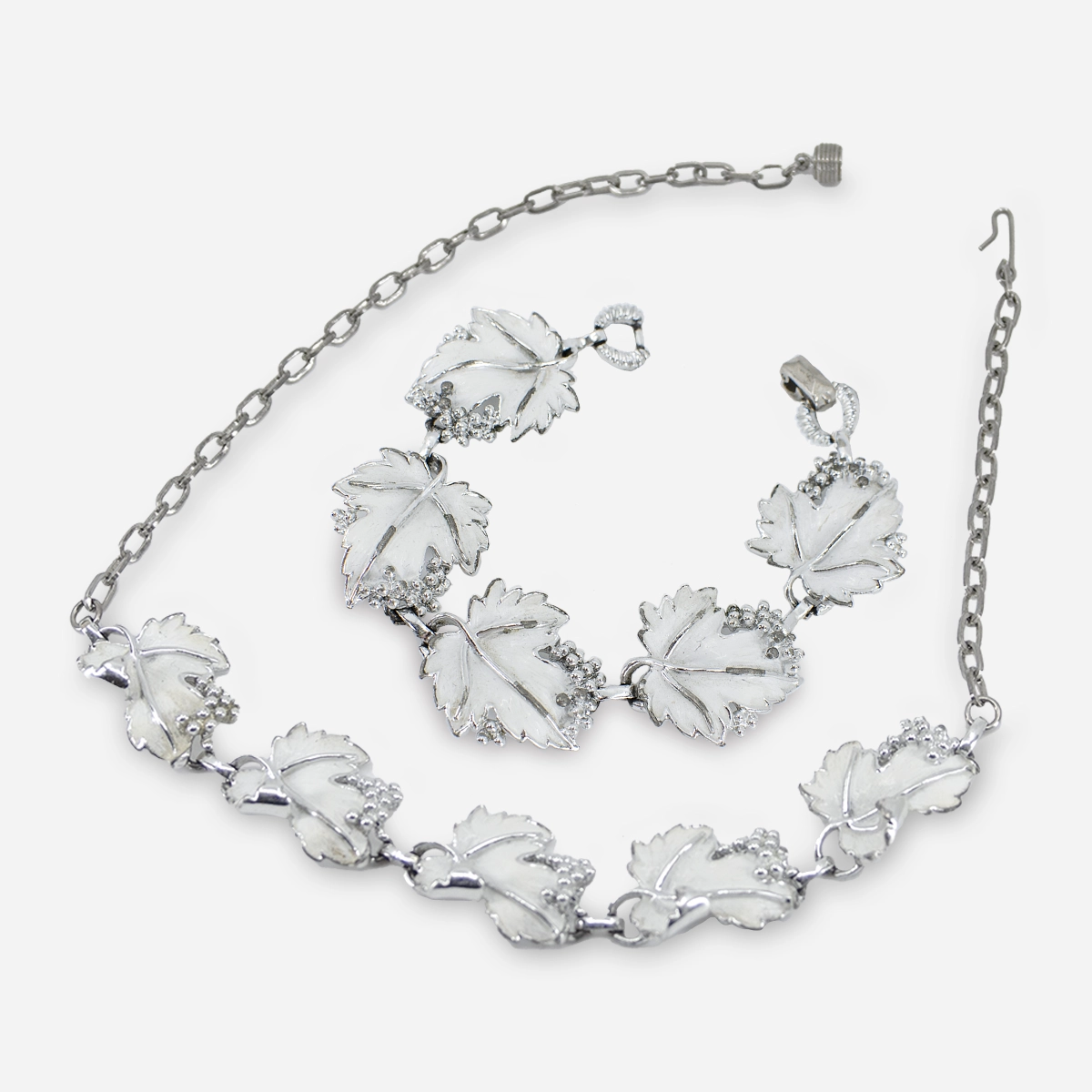 Whispering Jewelry, white enamel floral necklace and bracelet, 1959