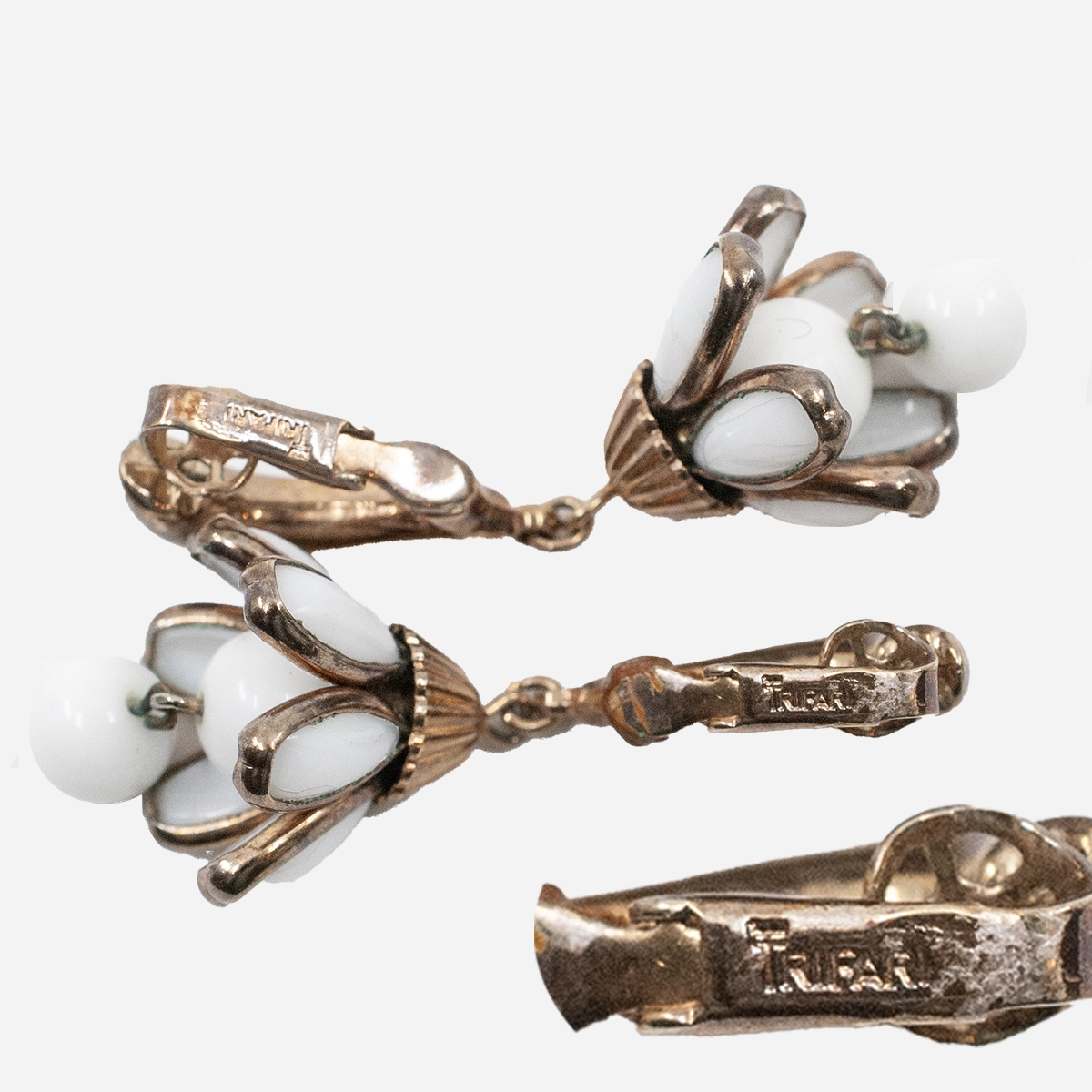 Signed trifari milk glass clip earrings