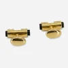 1970s onyx and gold-tone fixed oval backs 1970s onyx and gold-tone cufflinks with a bold barrel design and fixed oval backs. A sleek finish for tuxes or French cuffs.