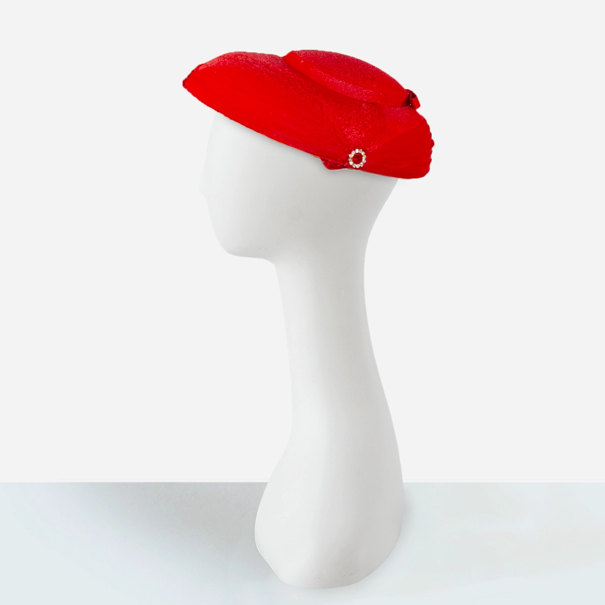 red womens hat with netting veil