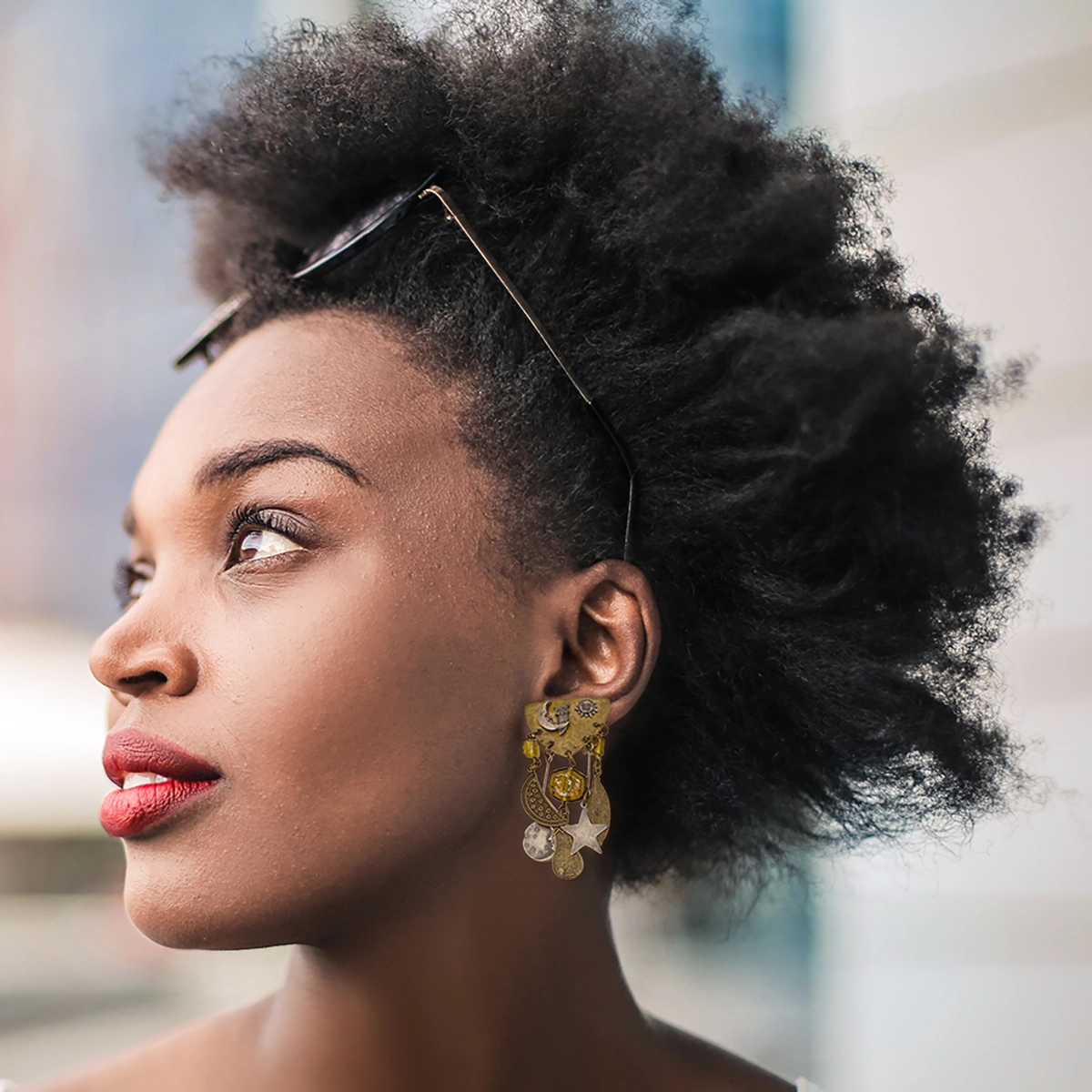 susan-l-richardson-moon-stars-earrings dangle earrings on model