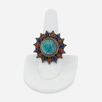 "Vintage boho statement ring with round turquoise center, red coral and blue lapis cabochons in a flower design."