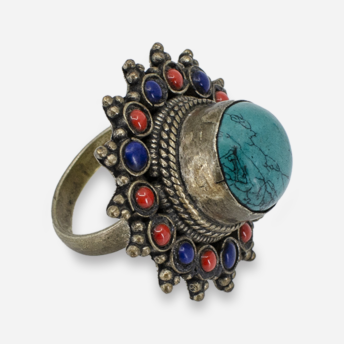 Side view of turquoise, coral, and lapis ring showing raised bezel setting and ornate silver detail