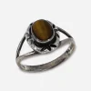 vintage tigers eye ring Close-up of warm golden-brown tiger’s eye stone with visible chatoyancy, bezel set in sterling silver.