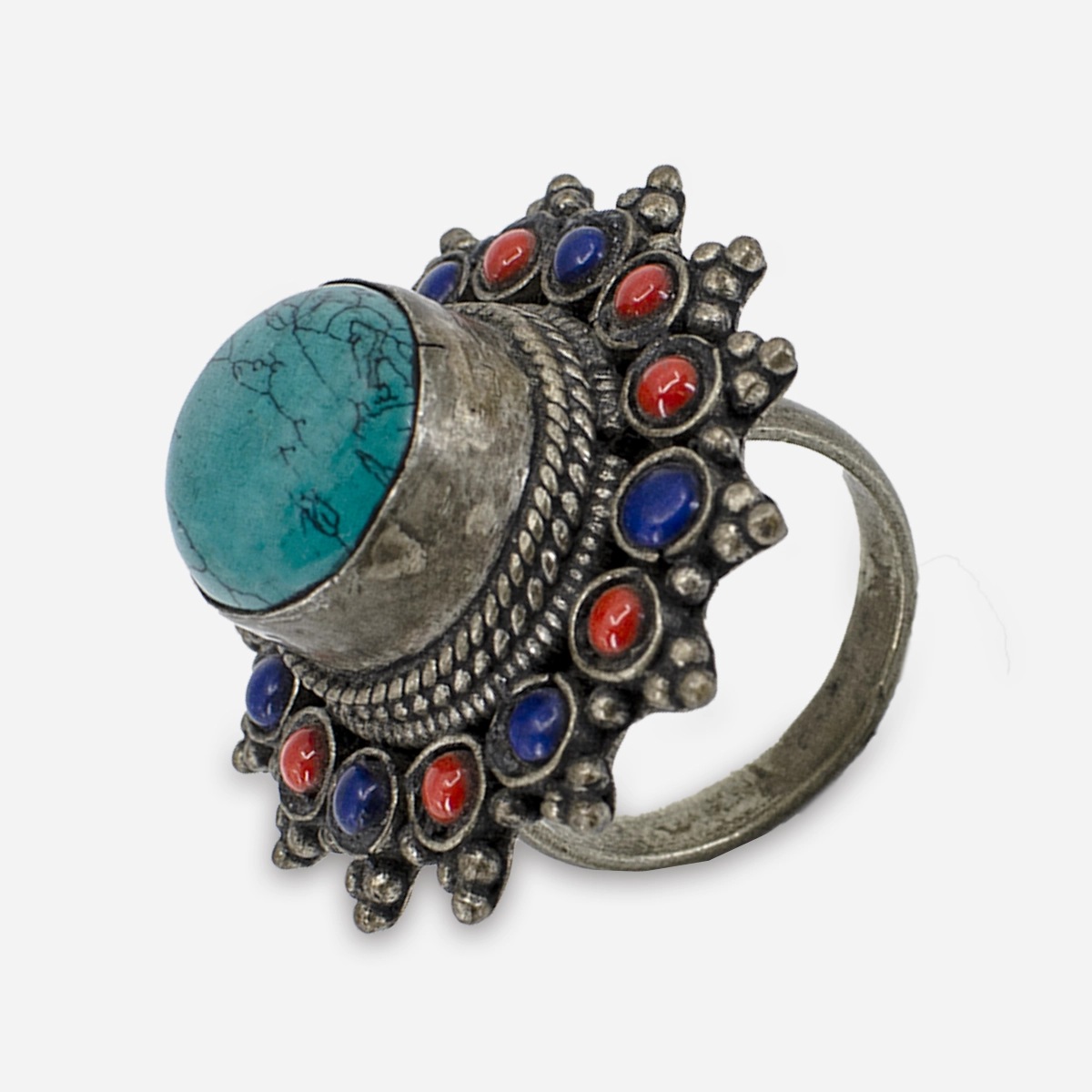 Angled view of large turquoise cabochon ring with colorful cabochon flower design