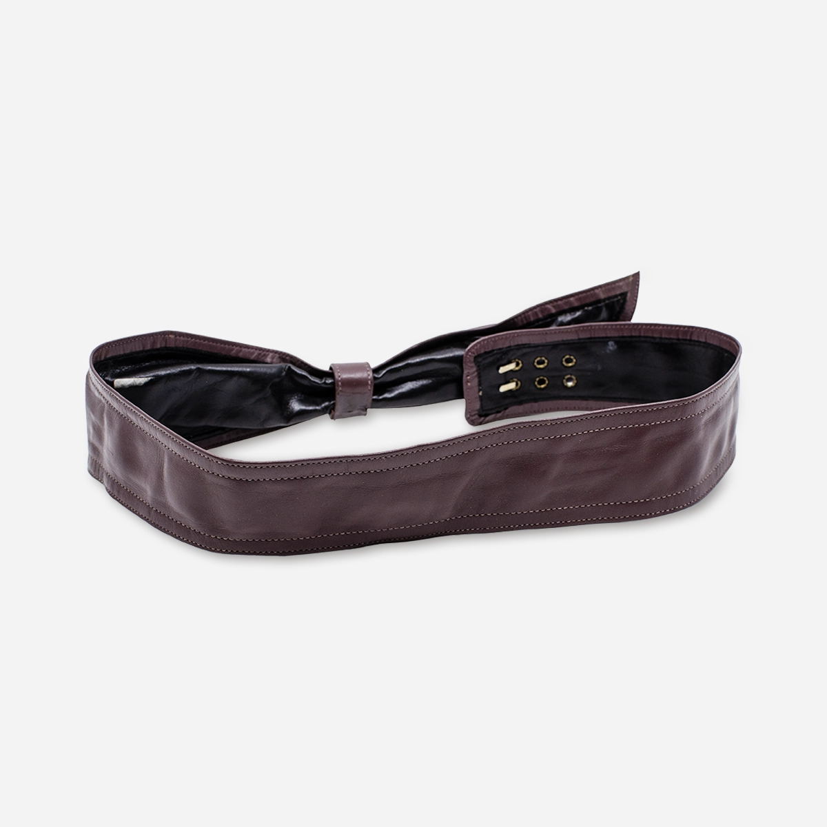 Back view showing stitching on purple leather bow belt.