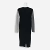 Back view: Solid black back of Fabrikant dress with back zipper and long sleeves.