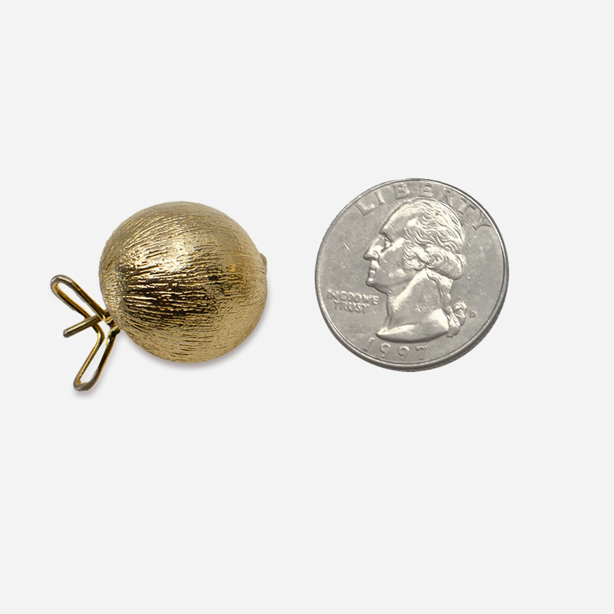 950s brushed gold button earring shown beside a U.S. quarter for scale.