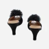 vintage black high heel mules Back angle of 1950s Daniel Green boudoir slippers highlighting curved heels.