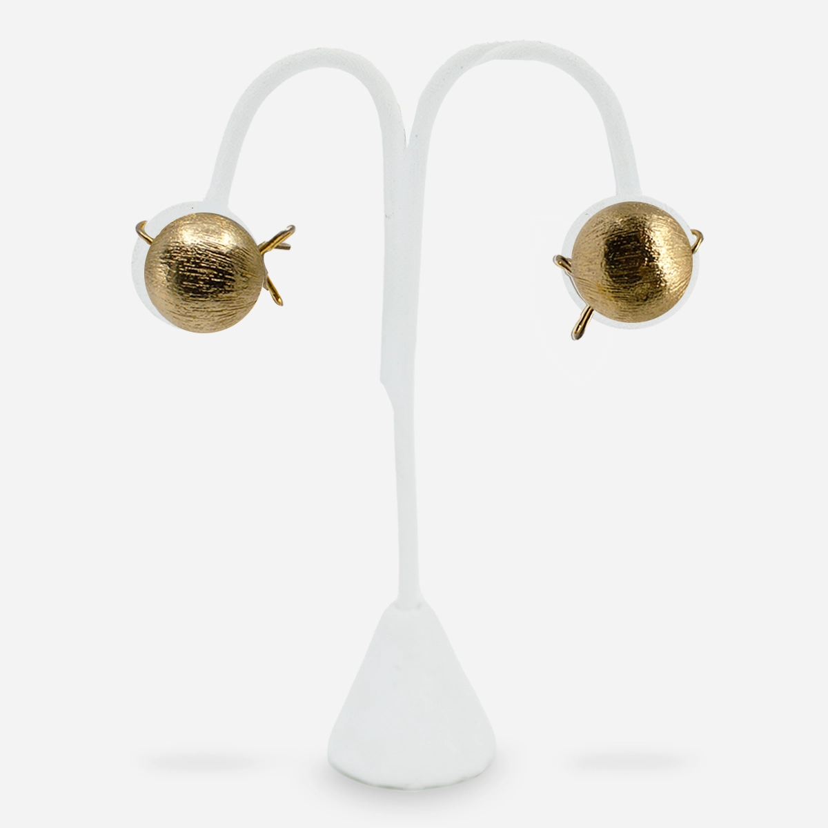 1950s brushed gold button earrings on white earring stand, front view.