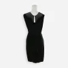 Back view: Back of 1960s black cocktail dress showing sheer illusion panel and keyhole opening