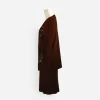 Side view of the Steve Fabrikant brown knit jacket showing the long silhouette and gold stud embellishment.