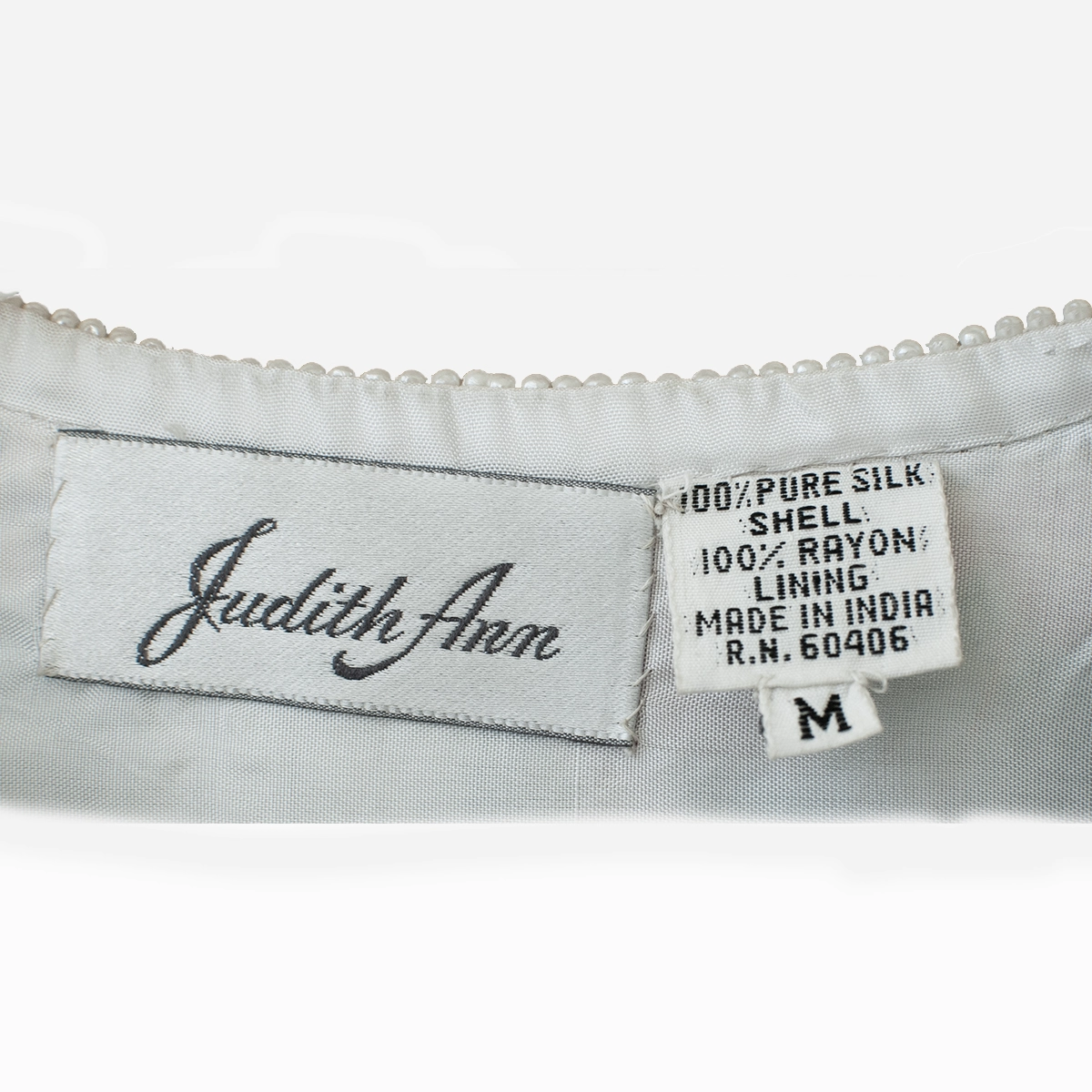 Judith Ann Creations label and fabric tag close-up