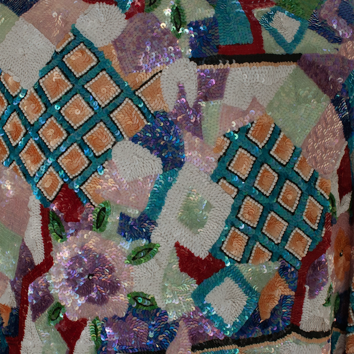 Detail of hand-sequined floral and geometric beadwork on jacket