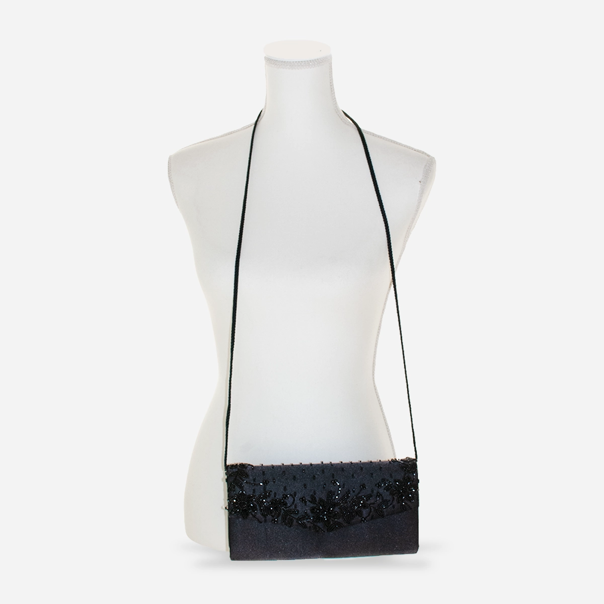 Black beaded evening bag shown on mannequin as a crossbody.