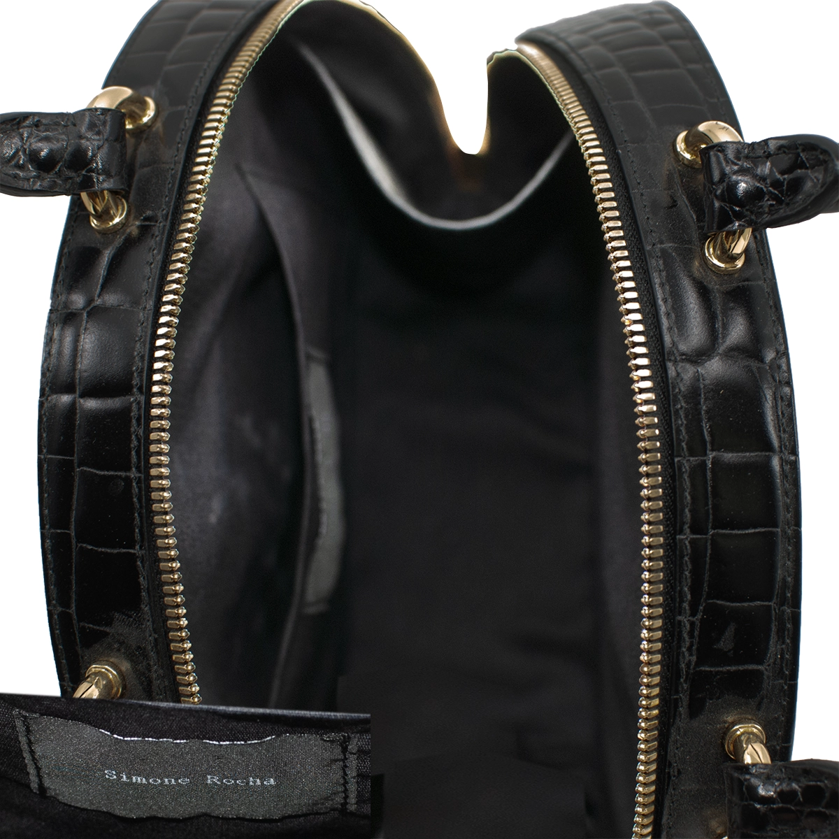 vintage hatbox style handbag Interior view of Simone Rocha handbag showing lining and small pocket.