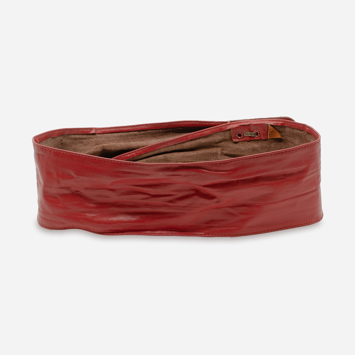 Back view of vintage red leather wrap belt showing smooth finish and three-hole hook closure.