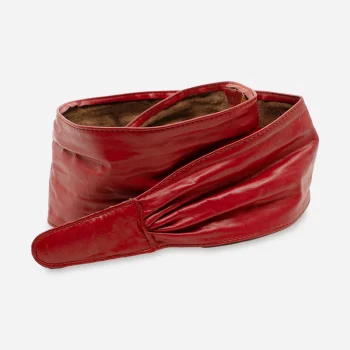 Folded view of vintage red leather belt emphasizing supple leather and sculptural front design.