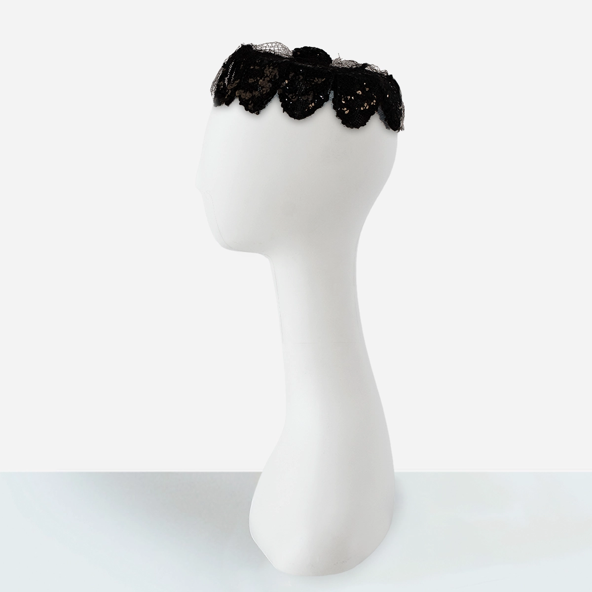 1950 black vintage hat Side view of black vintage sequin pillbox cocktail hat.