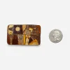Scale photo of David Andersen Autumn enamel brooch next to US quarter.
