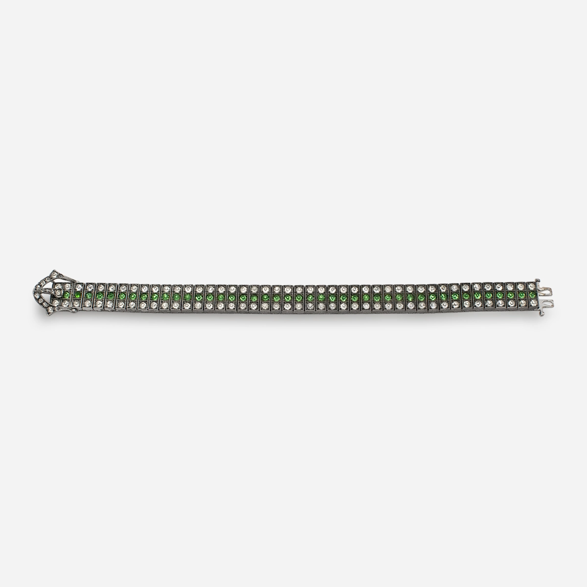 Front view of Art Deco Diamonbar sterling silver buckle bracelet with green and clear paste rhinestones