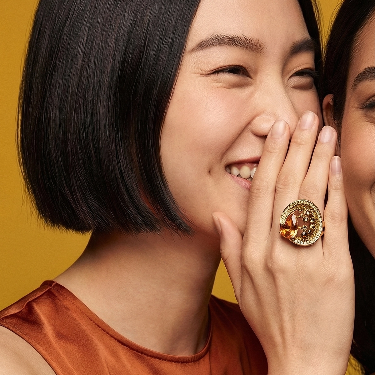 Crystal statement ring in amber and peridot on model