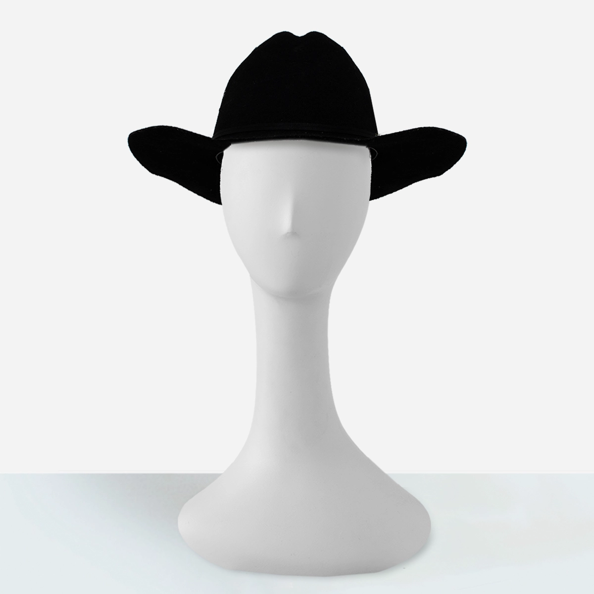 Front view of women’s black wool felt cowboy hat, structured crown and flat brim