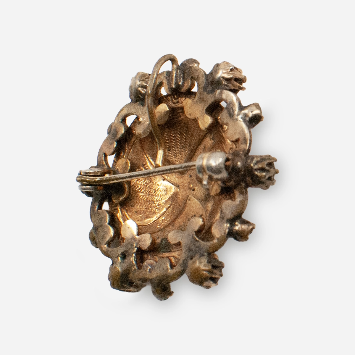 Side view of Victorian blue enamel brooch with raised relief and prong-set stones