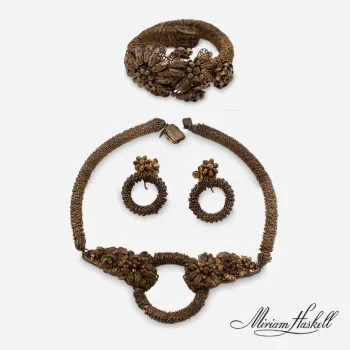 signed Miriam Haskell brass jewelry set. Necklace, earrings and bracelet.