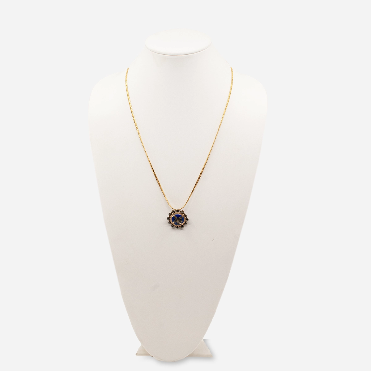 Victorian blue enamel brooch shown as pendant on gold chain.