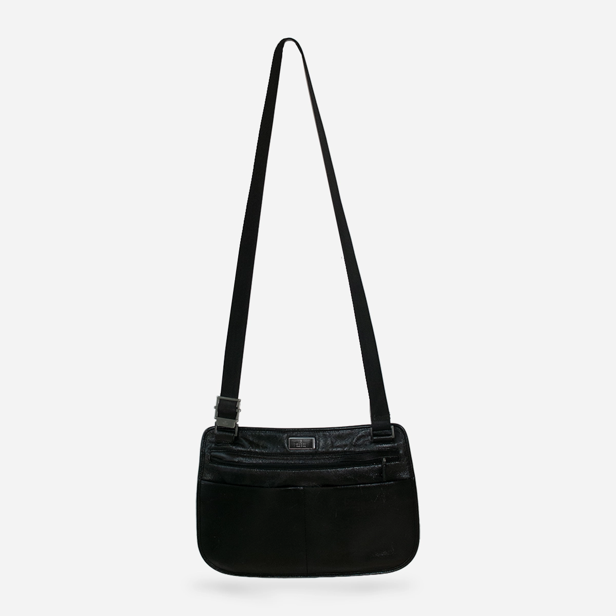Vintage Gucci black leather crossbody bag with adjustable strap.