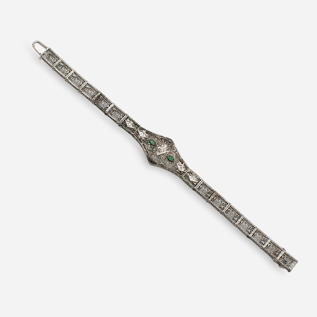 vintge emerald paste edwardian bracelet back view of antique silver filigree bracelet with tab clasp.