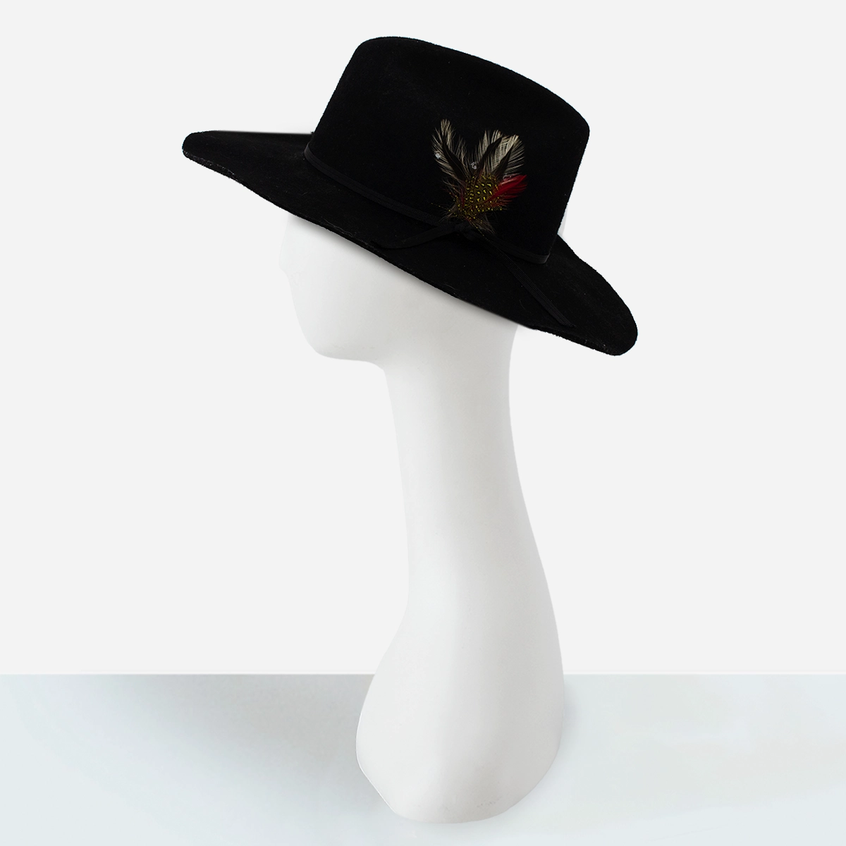 Side view of vintage black felt Western cowboy hat