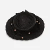 Wide brim 1930s black straw hat with black French veil trim and pink poms.
