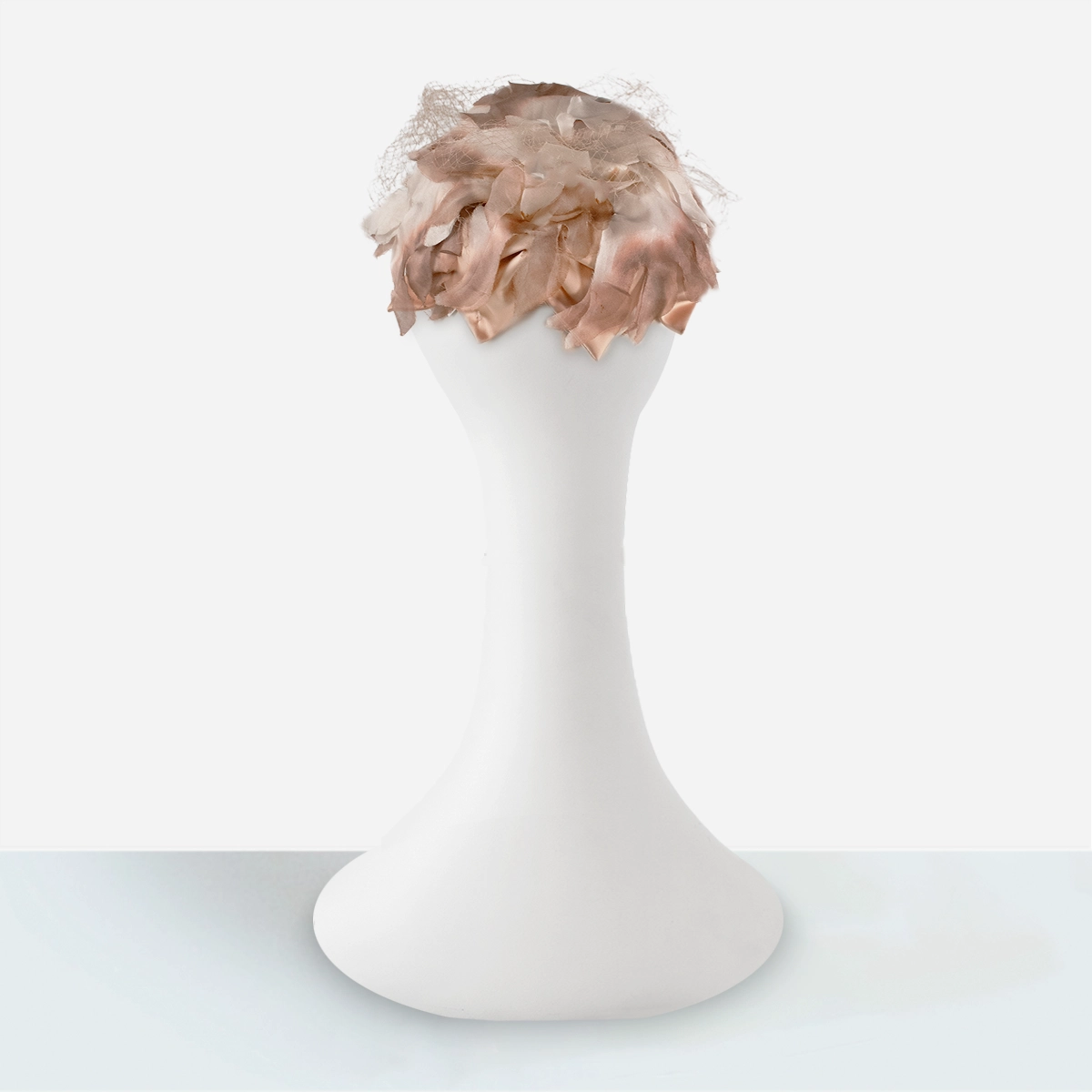 Rear view of vintage 1950s dusty pink silk cocktail hat.