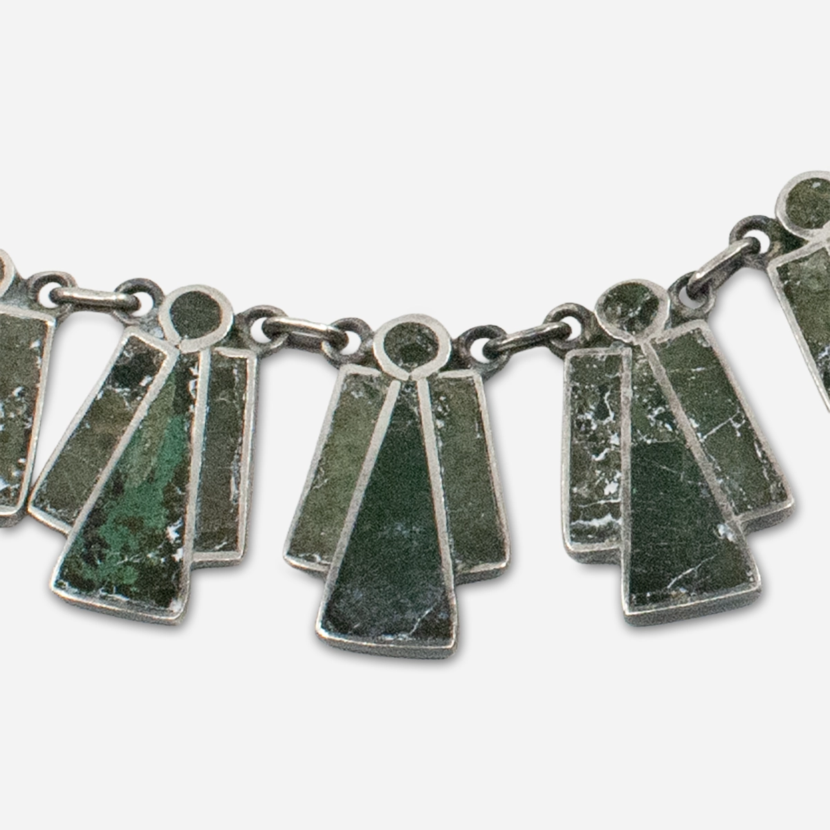 Close-up of green turquoise slab inlay in Taxco sterling silver necklace