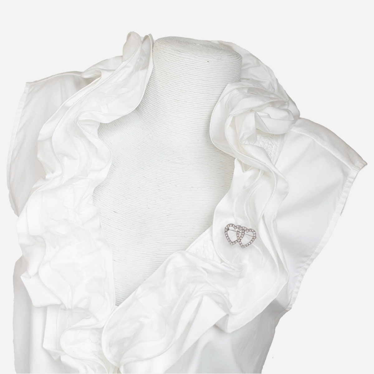 Ruffled blouse with heart pin