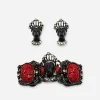 Selini jewelry set Selini figural Blackamoor bracelet, 1950s, carved black resin heads with red cabochons and rhinestone detail.