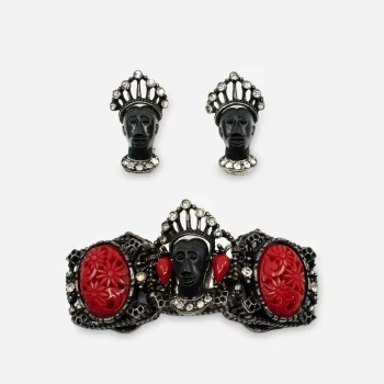 Selini figural Blackamoor bracelet, 1950s, carved black resin heads with red cabochons and rhinestone detail.