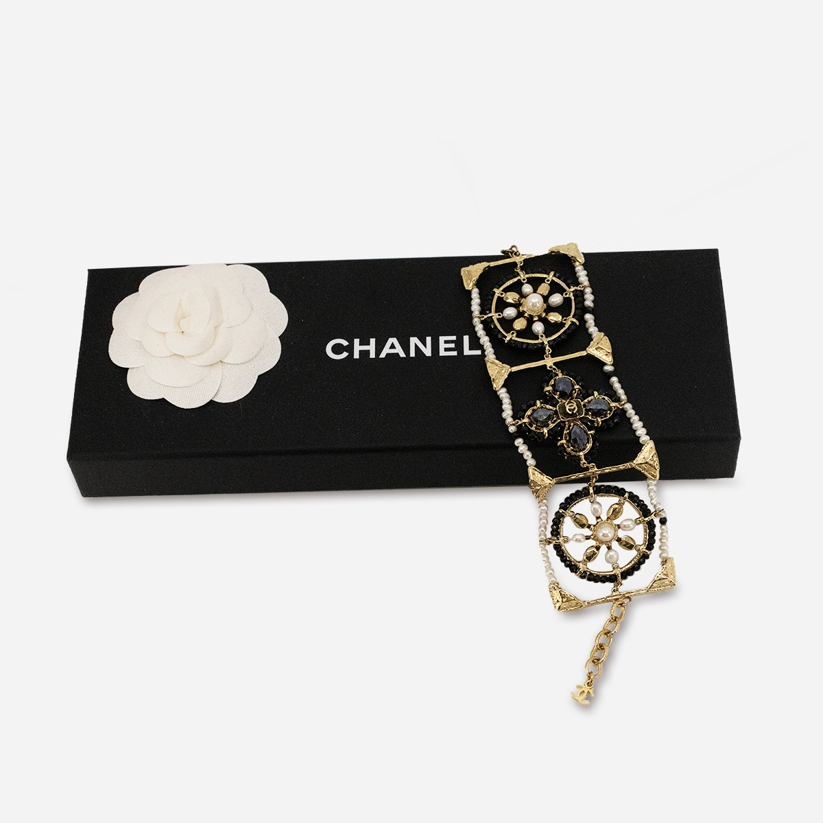 Chanel gilt gold openwork bracelet with lobster clasp and extension chain.