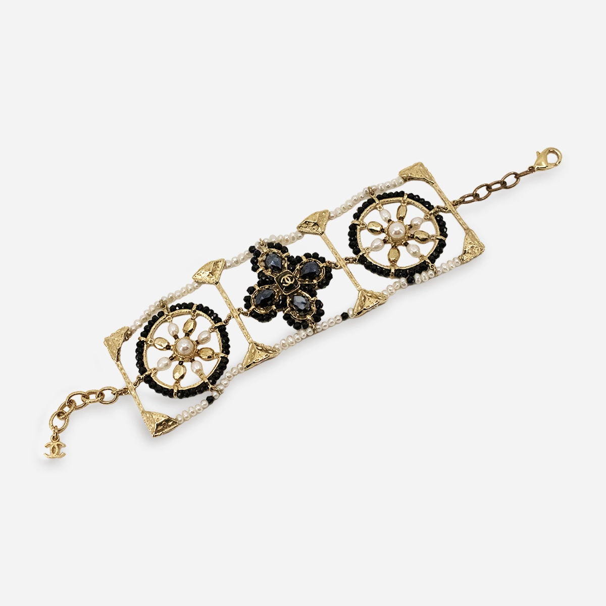 Vintage Chanel pearl and crystal openwork bracelet in gilt gold.