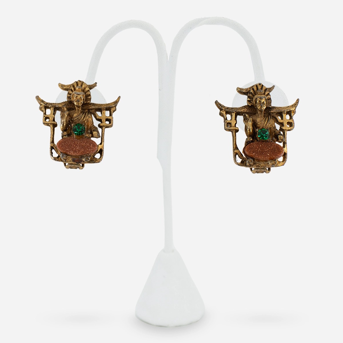 Close-up of 1950s Asian Revival earring showing green rhinestone and confetti Lucite detail